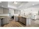 Modern kitchen featuring gray cabinets, granite countertops, stainless steel appliances, and wood-look flooring at 4146 Library St, Port Charlotte, FL 33948