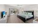 Bedroom with a king bed and an outdoor view of the pool at 4146 Library St, Port Charlotte, FL 33948