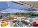Relaxing screened lanai with plush seating, pool, canal views, and dining area perfect for entertaining at 4146 Library St, Port Charlotte, FL 33948