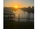 Waterfront property with boat dock, perfect for sunset views and boating activities at 4146 Library St, Port Charlotte, FL 33948