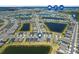 Community aerial view featuring lake views, manicured landscaping and neighborhood amenities at 43839 Seedling Ter, Punta Gorda, FL 33982