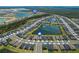 Stunning aerial view of the community showcasing lush landscaping, scenic ponds and amenities at 43839 Seedling Ter, Punta Gorda, FL 33982