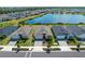 An aerial view of homes in the community with manicured lawns and water views at 43839 Seedling Ter, Punta Gorda, FL 33982