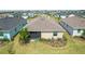 Aerial view of a backyard featuring a screen porch and well-maintained landscaping at 43839 Seedling Ter, Punta Gorda, FL 33982