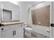 Well-lit bathroom featuring a granite-topped vanity and a shower-over-tub configuration at 43839 Seedling Ter, Punta Gorda, FL 33982