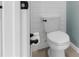 A clean, well-maintained bathroom featuring a toilet with white shiplap accent wall at 43839 Seedling Ter, Punta Gorda, FL 33982