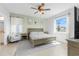 Serene bedroom with natural light, a ceiling fan, and neutral decor for a calming retreat at 43839 Seedling Ter, Punta Gorda, FL 33982