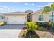 Charming single Gathering home with a two car garage, brick paver driveway, and nicely landscaped yard at 43839 Seedling Ter, Punta Gorda, FL 33982