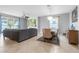Open-concept living room with tile flooring, recessed lighting, and large windows providing ample natural light at 43839 Seedling Ter, Punta Gorda, FL 33982