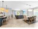 Open-concept living space features dining area and Gathering room with lots of natural light at 43839 Seedling Ter, Punta Gorda, FL 33982