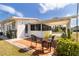 Cozy backyard patio featuring a brick flooring with beautiful plants at 5179 Grobe St, North Port, FL 34287