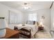 Bedroom with natural light, bed with blue pillows, and furniture pieces at 5179 Grobe St, North Port, FL 34287