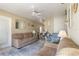 Comfortable living room featuring an open layout, ceiling fan, and neutral color palette at 5179 Grobe St, North Port, FL 34287