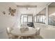 Bright, enclosed patio featuring tile floors, plenty of natural light, and a cozy seating area at 5179 Grobe St, North Port, FL 34287