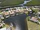 An aerial view of waterfront homes with docks and mangrove estuaries in a desirable residential community at 612 Macedonia Dr, Punta Gorda, FL 33950