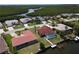 An aerial view of a single-Gathering home features a screened lanai, a private dock, and waterfront access at 612 Macedonia Dr, Punta Gorda, FL 33950