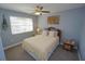 Cozy bedroom with neutral walls, window, and decorative elements at 612 Macedonia Dr, Punta Gorda, FL 33950