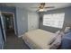 Cozy bedroom featuring a ceiling fan, closet, and a bright window providing natural light at 612 Macedonia Dr, Punta Gorda, FL 33950