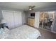 Bedroom features sliding glass doors to the lanai, ceiling fan, and closet at 612 Macedonia Dr, Punta Gorda, FL 33950