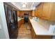 Well-lit kitchen featuring wood cabinets, stainless steel appliances, and bright countertops at 612 Macedonia Dr, Punta Gorda, FL 33950