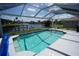 Waterfront pool features waterfront views with a clear screen enclosure at 612 Macedonia Dr, Punta Gorda, FL 33950