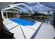 Covered swimming pool with clear blue cover offering stunning waterfront views at 612 Macedonia Dr, Punta Gorda, FL 33950