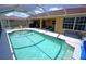 Beautiful screened-in pool with a sunny deck and cool, clear water for relaxing swims at 612 Macedonia Dr, Punta Gorda, FL 33950