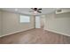Bright bedroom with wood look tile floors and a ceiling fan, perfect for a restful night's sleep at 654 Aqui Esta Dr, Punta Gorda, FL 33950