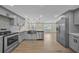Spacious kitchen with modern appliances, sleek countertops, and open layout to living area at 654 Aqui Esta Dr, Punta Gorda, FL 33950