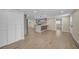 Spacious living room featuring wood-look floors, neutral paint, and an open-concept design at 654 Aqui Esta Dr, Punta Gorda, FL 33950