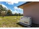 Backyard with a Generac generator providing backup power for the home at 661 Athos Ter, Port Charlotte, FL 33952