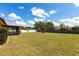 Expansive backyard with plenty of space for recreation, complemented by tidy landscaping at 661 Athos Ter, Port Charlotte, FL 33952
