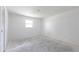 A bright, empty bedroom features a window that provides ample natural light at 661 Athos Ter, Port Charlotte, FL 33952