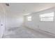 A bright bedroom features two windows, offering ample natural light at 661 Athos Ter, Port Charlotte, FL 33952