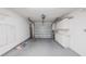 A spacious garage featuring white cabinetry for storage at 661 Athos Ter, Port Charlotte, FL 33952