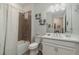 This bathroom features a shower/tub combo, a single sink, and a decorative mirror at 8117 Thruso Rd, Port Charlotte, FL 33981