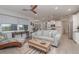 Bright living room offering modern decor, wood-look flooring, and an open layout at 8117 Thruso Rd, Port Charlotte, FL 33981