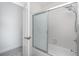 Bright bathroom features tiled shower over tub with sliding glass door at 814 Via Tripoli, Punta Gorda, FL 33950
