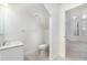 Clean bathroom with sink and toilet with a bright white interior and tile flooring at 814 Via Tripoli, Punta Gorda, FL 33950