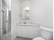 Clean bathroom featuring vanity, mirror, and toilet with tiled flooring at 814 Via Tripoli, Punta Gorda, FL 33950