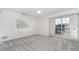 Bedroom with white walls, large window, and light-colored carpet at 814 Via Tripoli, Punta Gorda, FL 33950