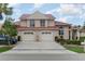 Charming two-story home with a rust colored roof, manicured landscaping, and a two-car garage at 814 Via Tripoli, Punta Gorda, FL 33950