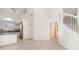 Open-concept kitchen featuring granite countertops, stainless steel appliances, and white cabinets at 814 Via Tripoli, Punta Gorda, FL 33950