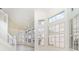 Bright living room with large windows, tile floors, and high ceilings at 814 Via Tripoli, Punta Gorda, FL 33950