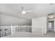 Bright upper loft with white railing and carpet floors at 814 Via Tripoli, Punta Gorda, FL 33950