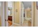 Hallway view of the bathroom and bedroom, showing the hardwood floors and finishes at 95 N Marion Ct # 126, Punta Gorda, FL 33950