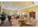 Spacious clubhouse featuring multiple seating areas, tables, and a bookcase at 95 N Marion Ct # 126, Punta Gorda, FL 33950