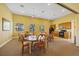 Community clubhouse with tables and chairs, kitchen, and natural light at 95 N Marion Ct # 126, Punta Gorda, FL 33950