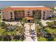 Beautiful condo building with lush landscaping, palm trees and well maintained grounds offering a luxury appeal at 95 N Marion Ct # 126, Punta Gorda, FL 33950