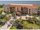 Beautiful condo building with lush landscaping, palm trees and well maintained grounds offering a luxury appeal at 95 N Marion Ct # 126, Punta Gorda, FL 33950